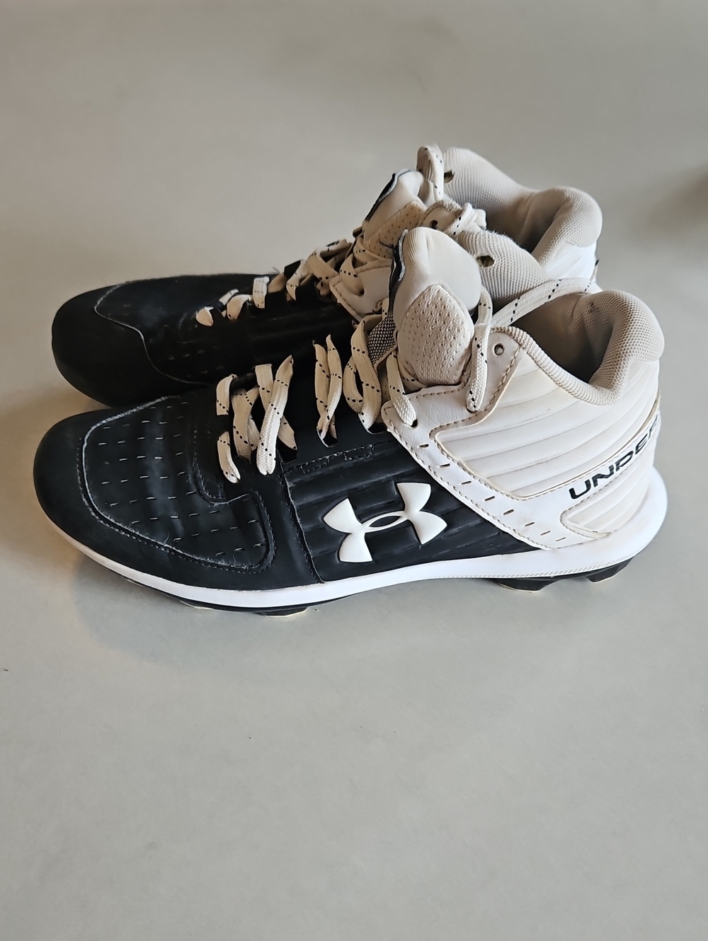 Under Armour Black and White Mid-Top Cleats